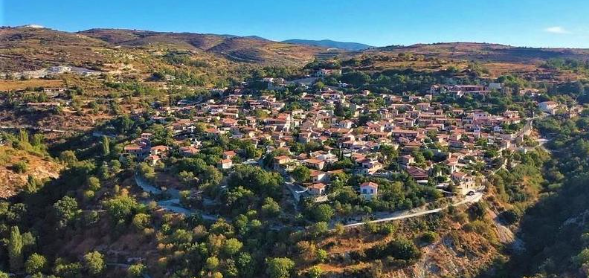 Aerial view of Arsos village surrounded by vineyards and hills